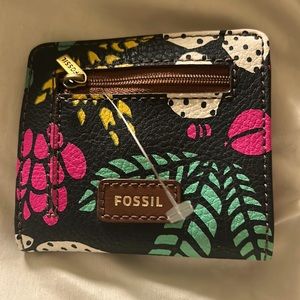 A Fossil wallet. Brand new and never used. Holds money, cards and change